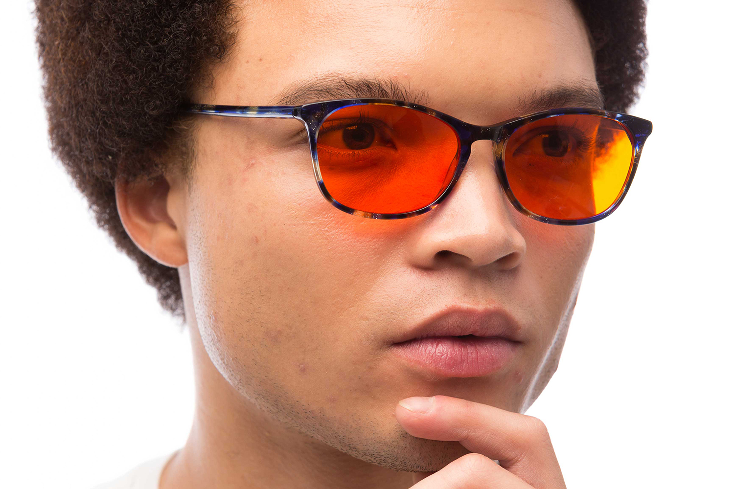 a man wearing a pair of sunglasses that block harmful blue light