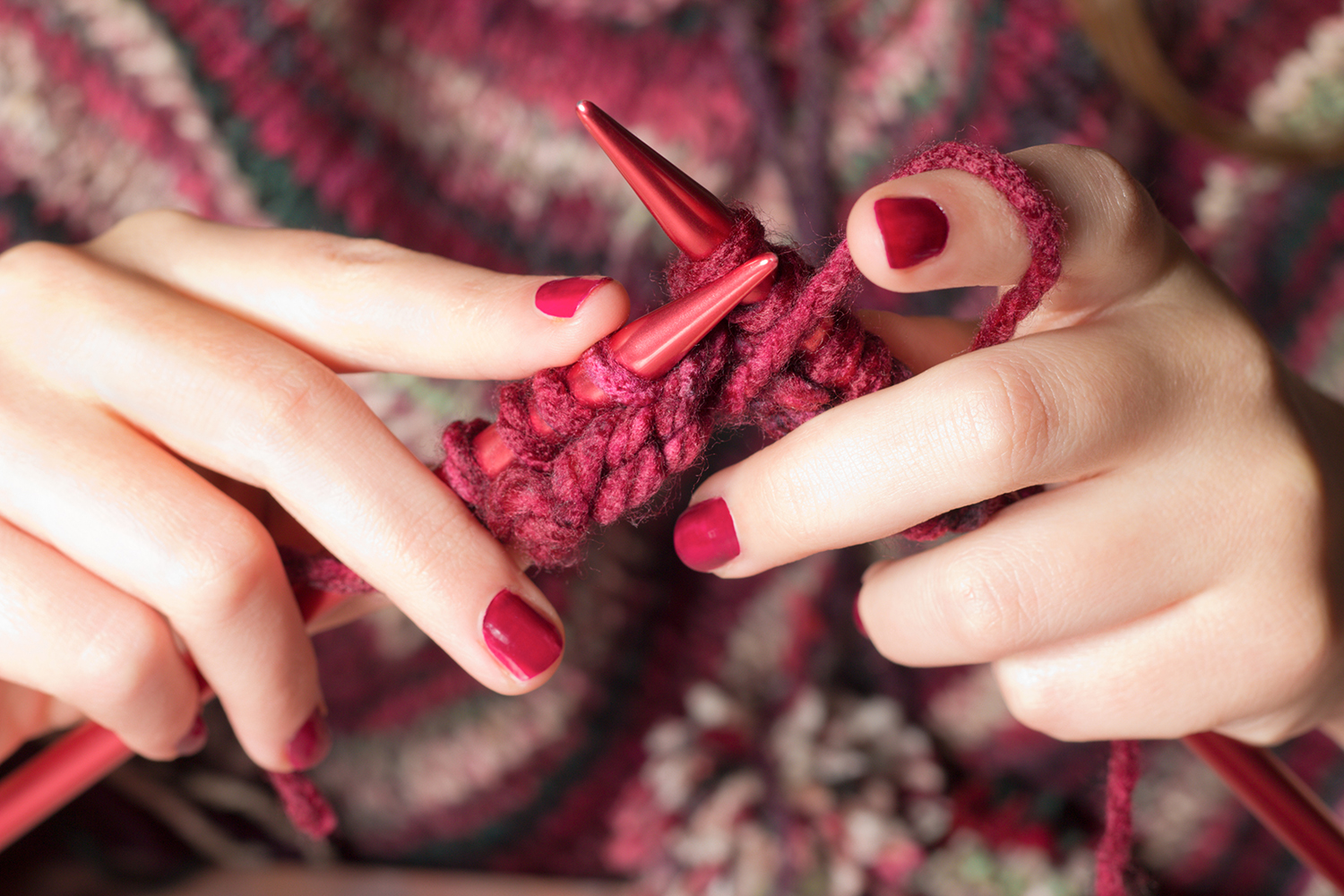 a young woman knitting as a hobby