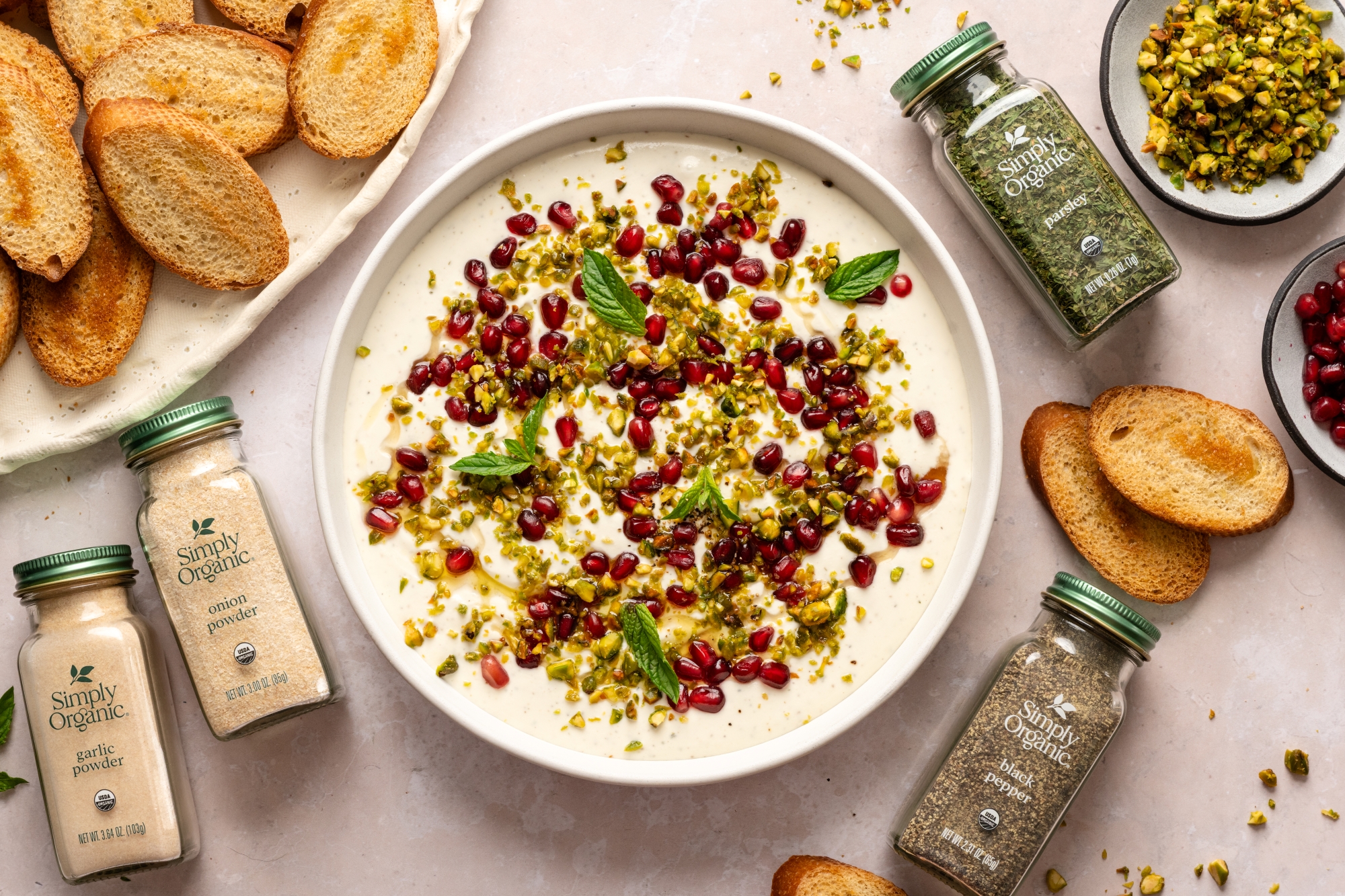 colorful dip with bottles of spices and bread