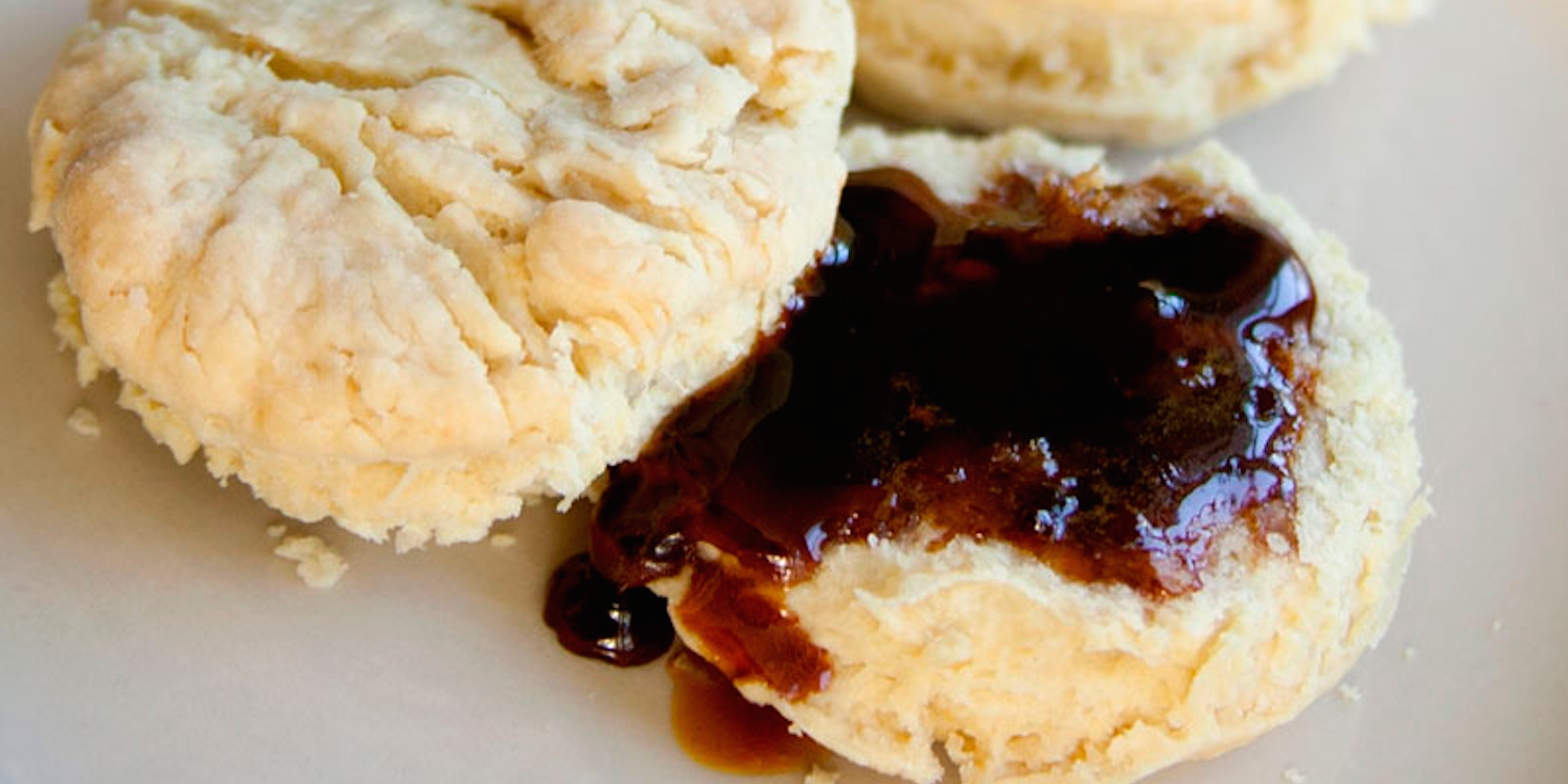 A serving of biscuits with sweet syrup on them