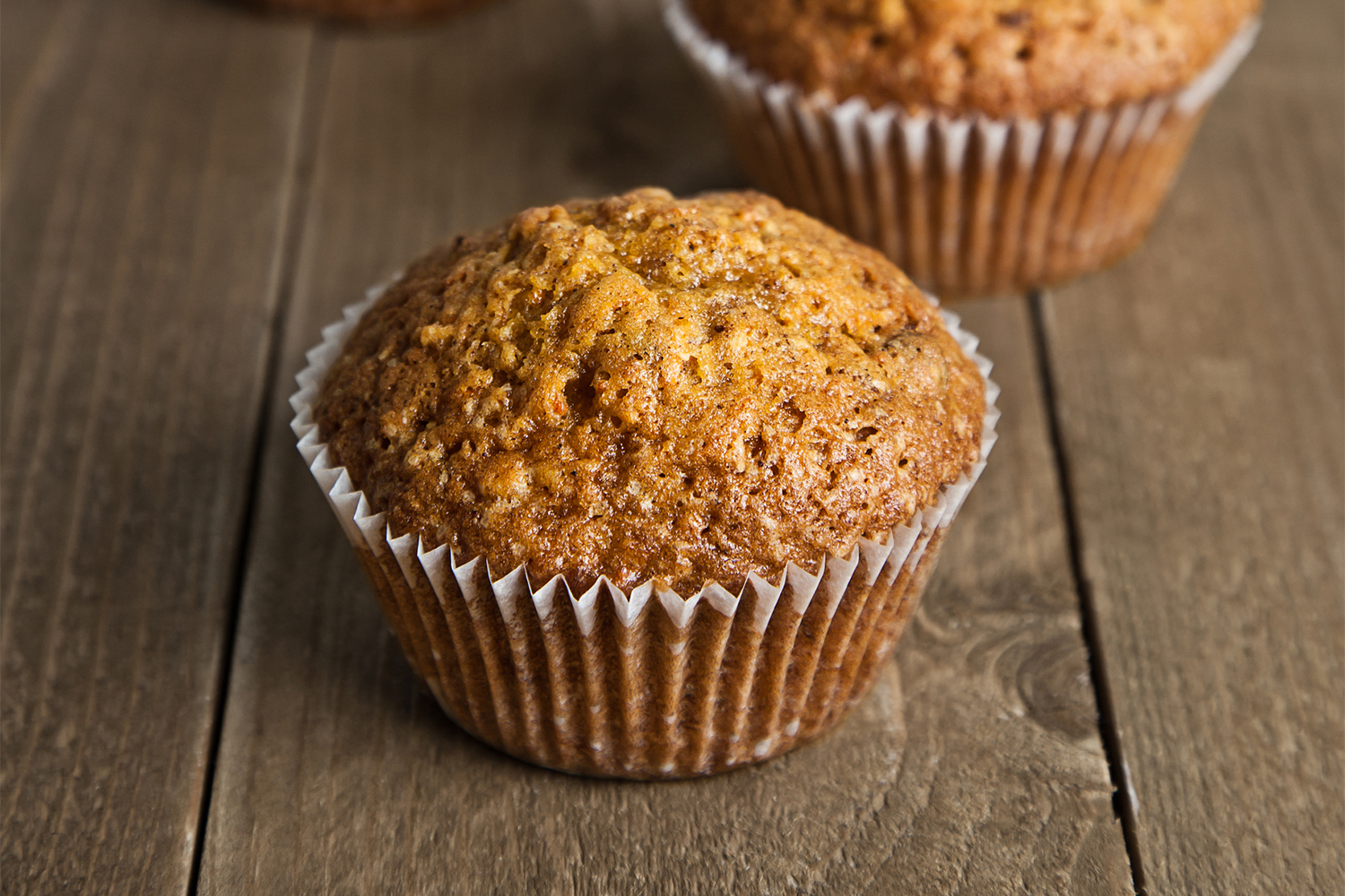 a freshly baked muffin in a cup