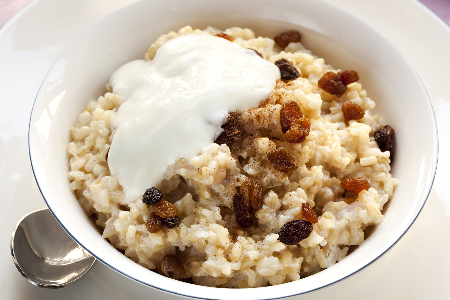 a bowl of rice porridge with nuts and fruit
