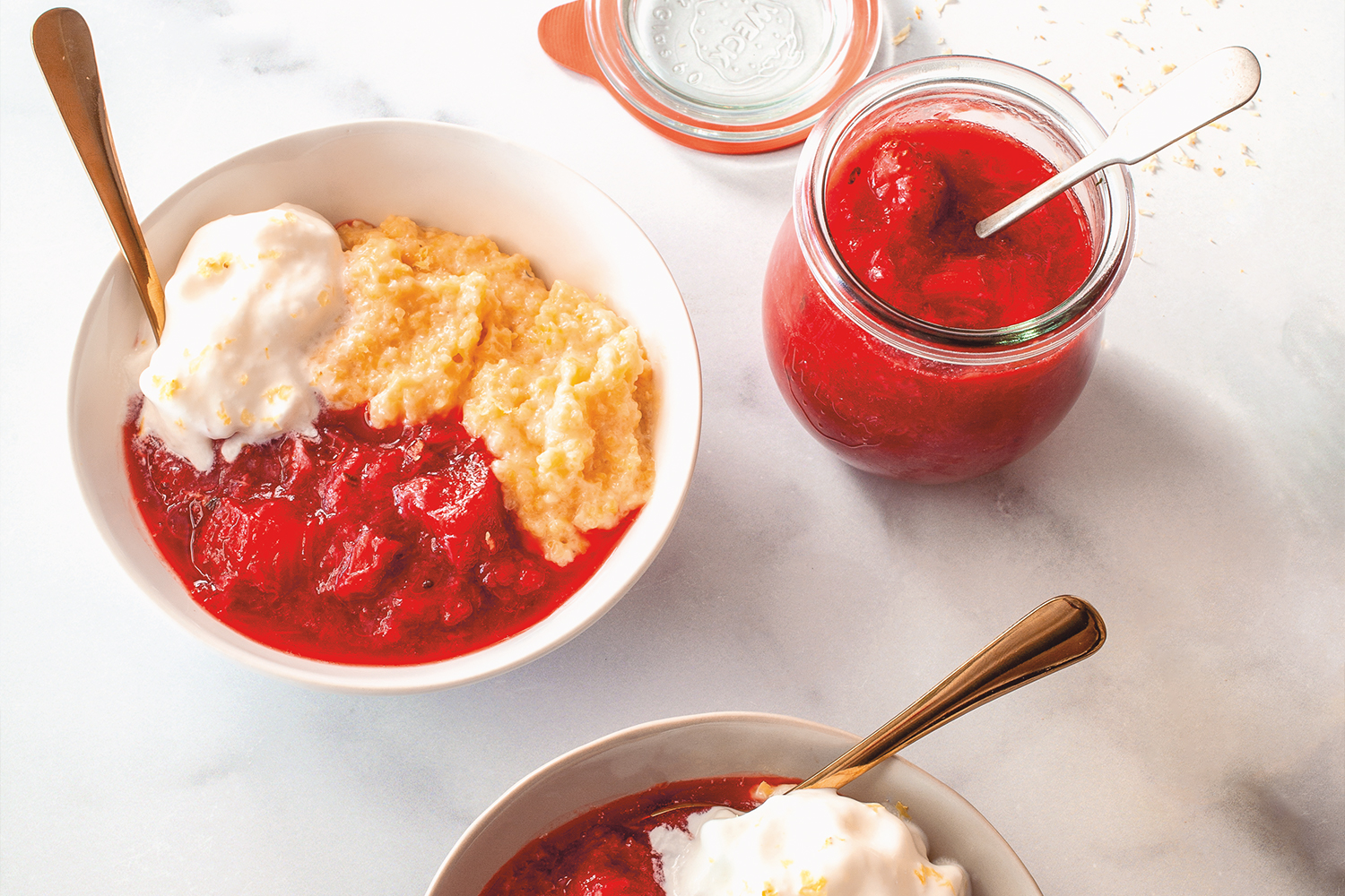 a bowl of cooked berries with cornmeal polenta and ice cream