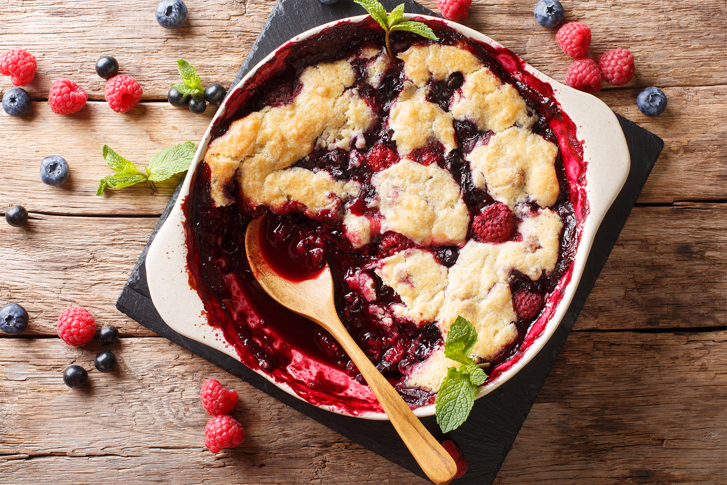 a dish of freshly baked berry cobbler