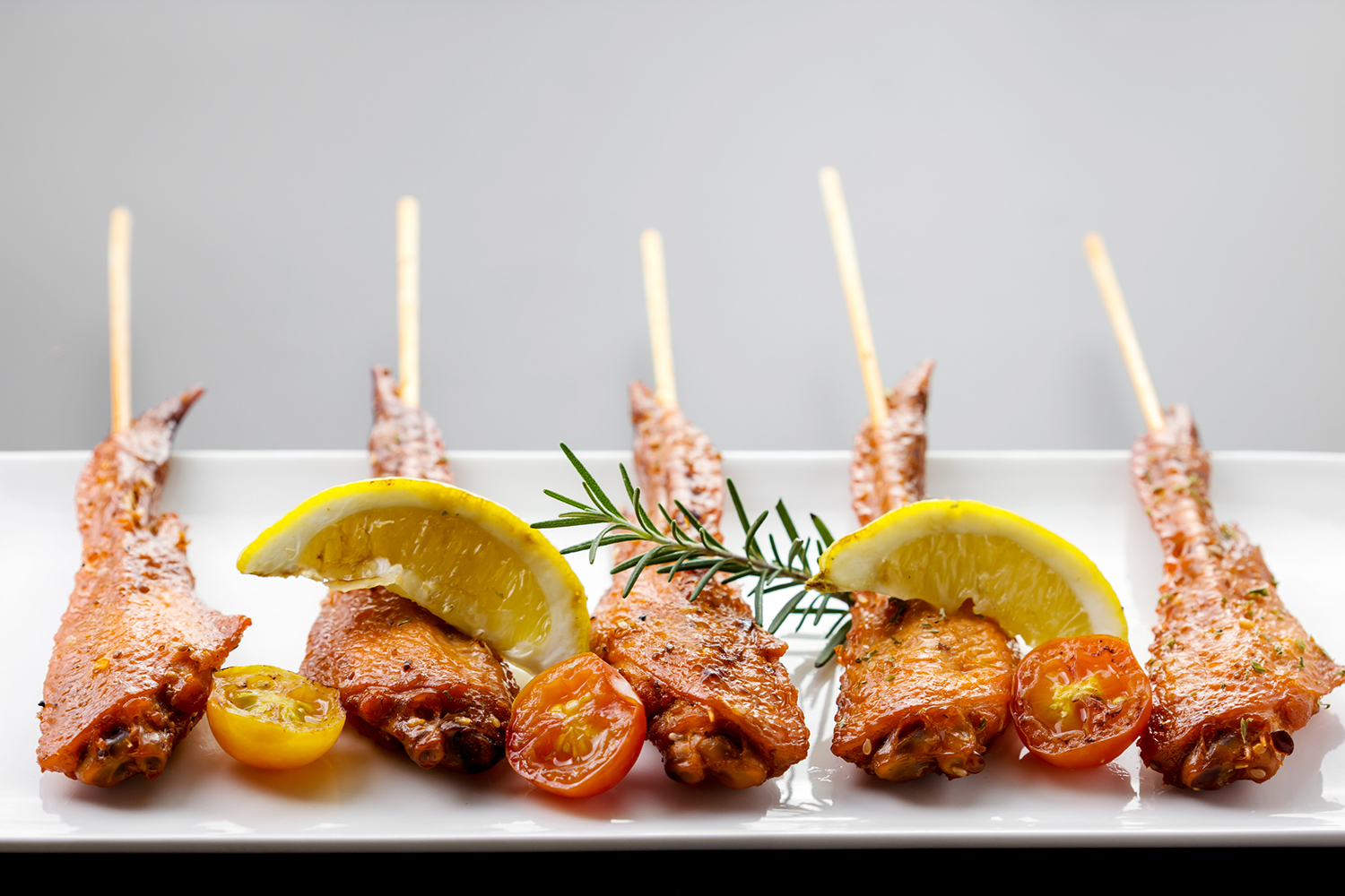 chicken skewers with peppers, rosemary, and lemon