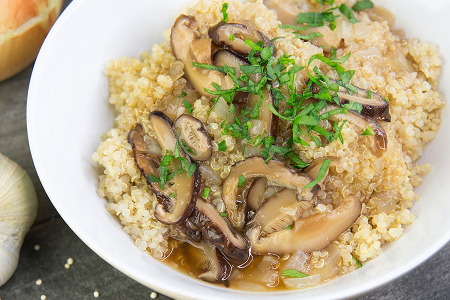a bowl of mushrooms over quinoa