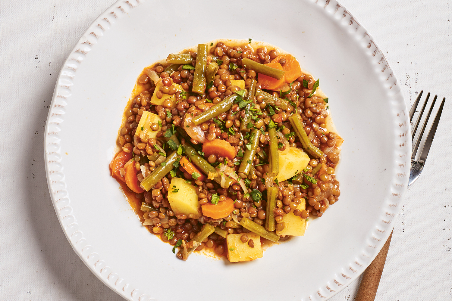 a plate of stewed lentils and green beans
