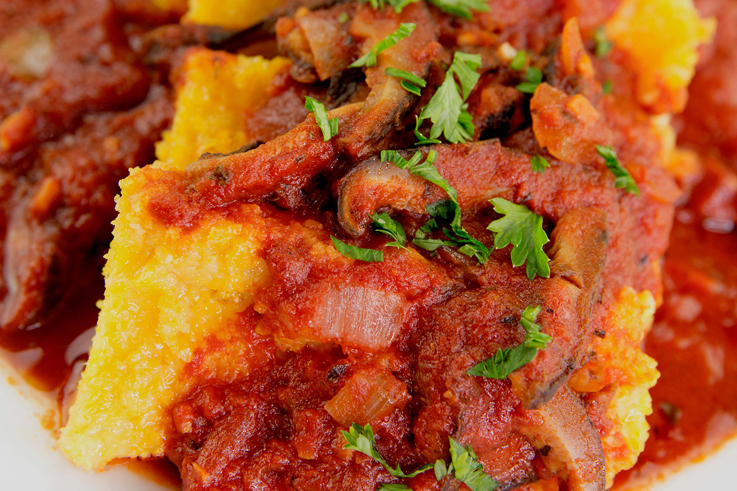 polenta slathered in spaghetti sauce and mushrooms