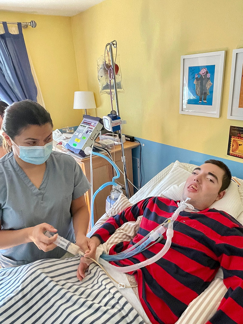 A nurse making use of Jovan's feeding tube