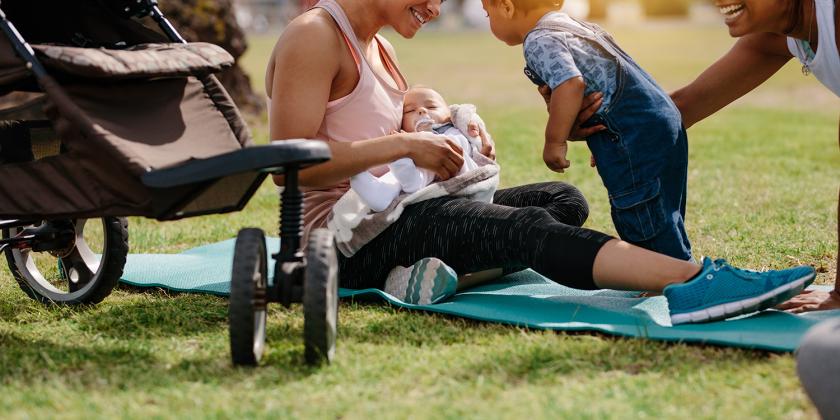 young mothers introducing their kids and babies at the park