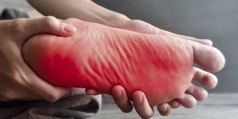 a foot writhing in pain and discomfort