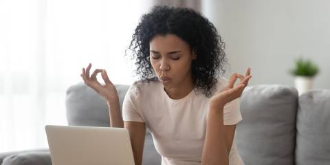 an anxious woman taking a deep breath
