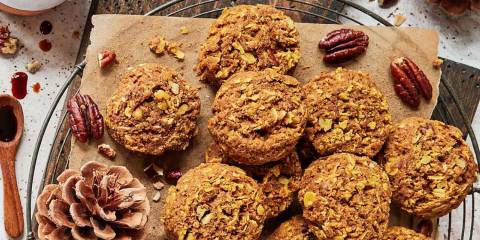 a plate of crispy pumpkin-pecan cookies