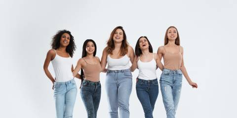 a group of happy, healthy women with different body types