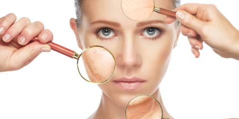 a woman's face under magnifying glasses