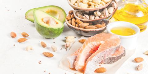 Foods full of healthy fats, like nuts, avocado, and salmon