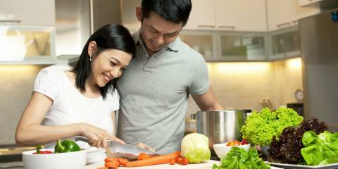 A couple preparing dinner together.