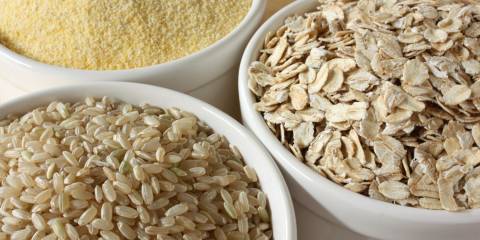 Three bowls of different grains.