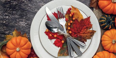A Thanksgiving placesetting with decorative gourds