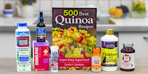 a selection of all-natural supplements and a book of gluten-free quinoa recipes