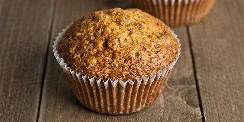 a freshly baked muffin in a cup