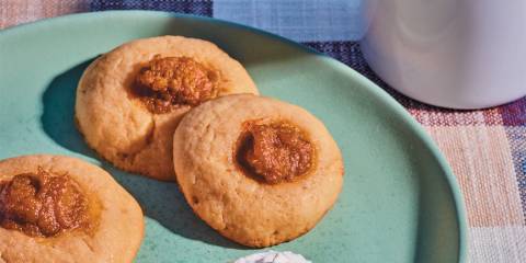 a plate of sugar cookies with dollops of pumpkin pie filling
