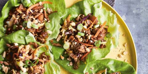 a plate of wraps with seasoned chicken