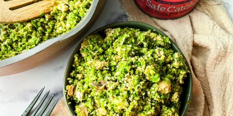 a bowl of broccoli and salmon