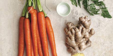 Carrots, ginger, and salt on a table