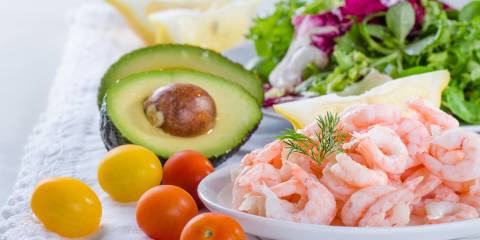 Shrimp and Avocado Paleo Salad ingredients, shrimp, tomato, avocado and lettuce.
