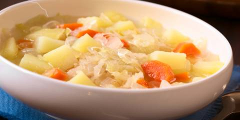 A bowl of vegetarian irish stew with cabbage and potatoes
