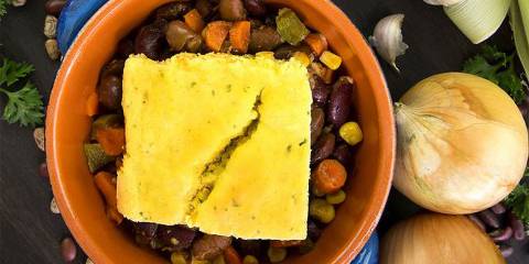 cornbread on top of a bowl of vegetarian chili