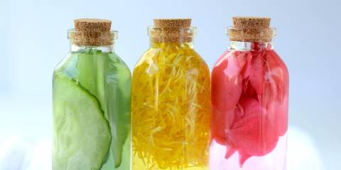 Three glass vial bottles of fresh natural plant based skin care facial toners.