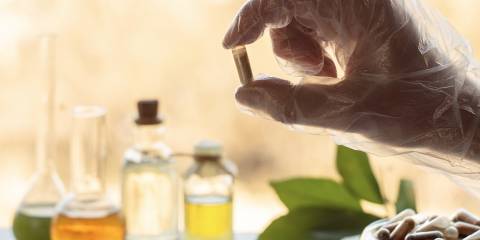 a scientist formulating a blend of natural ingredients