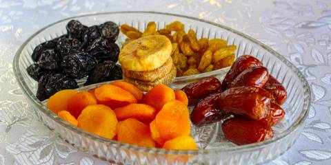 a glass tray of dried fruit