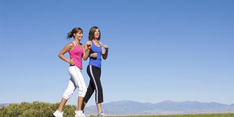 Two women walking together outside. 