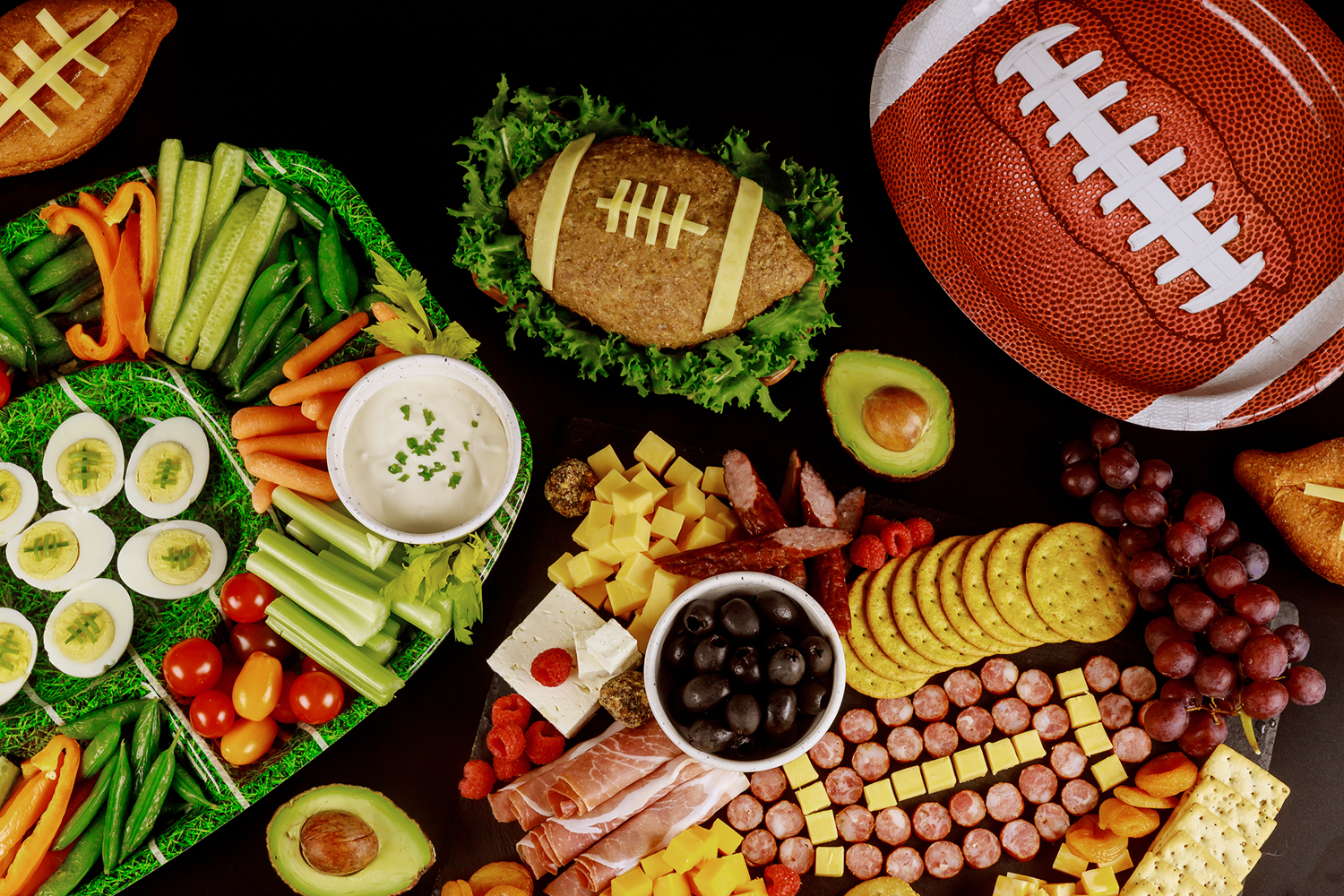 a football-themed spread of snacks and finger foods